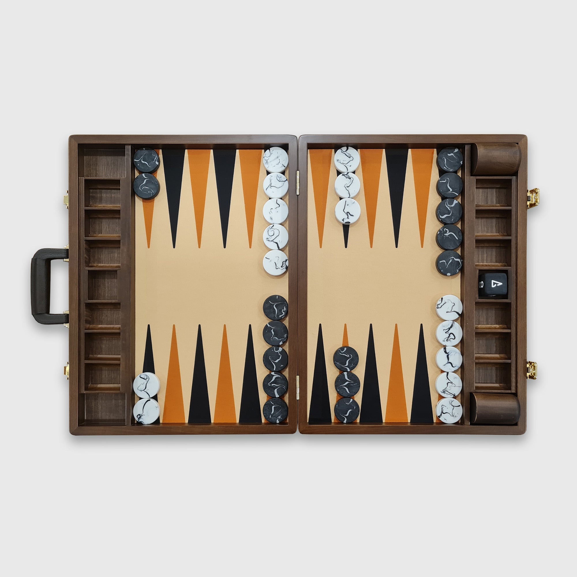 A tournament-sized Monte Carlo backgammon board with beige and brown faux leather surfaces, black and white checkers, a doubling cube, dice cups, and a handle.