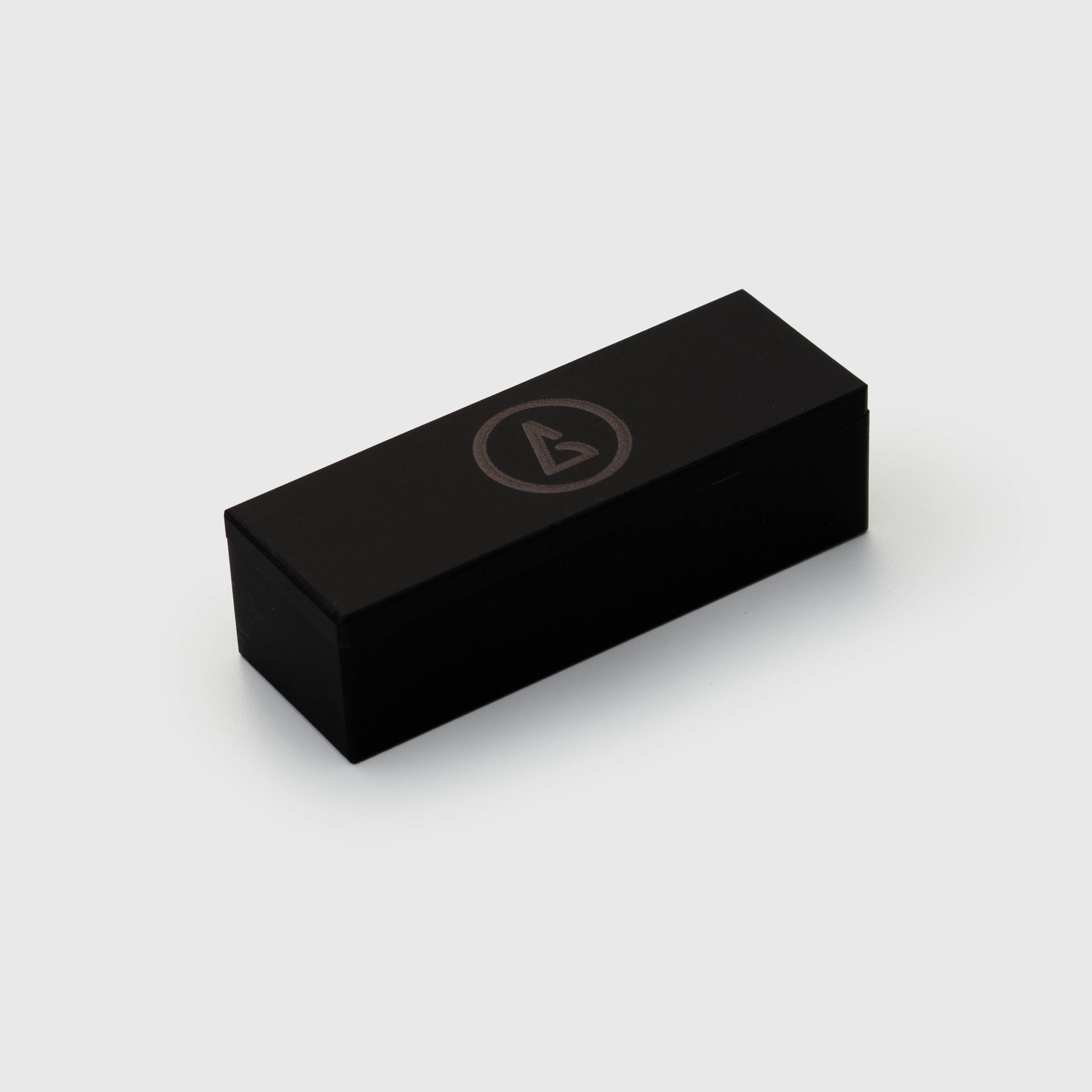 Matte black magnetic dice box with a subtle Galaxy logo, designed to hold four 14.3mm dice.