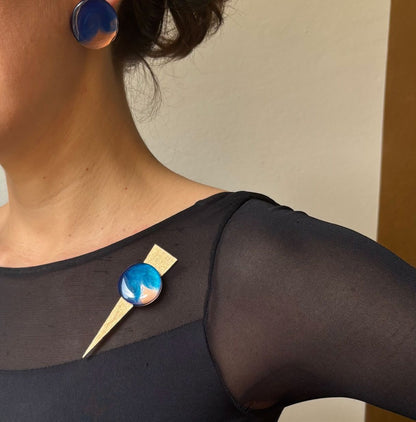 Checker on Point brooch worn
