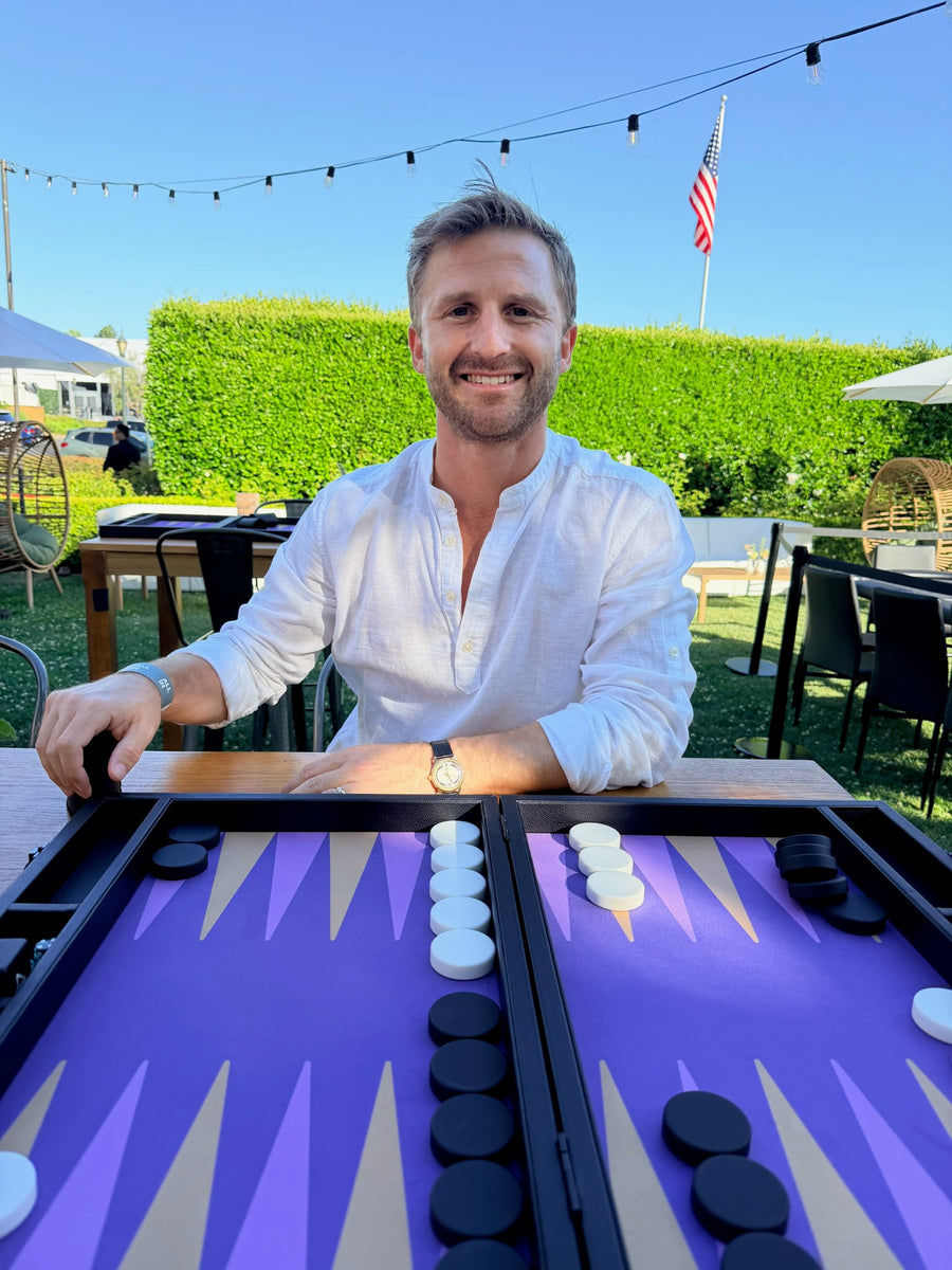 Player at a purple Nova board in the sunshine
